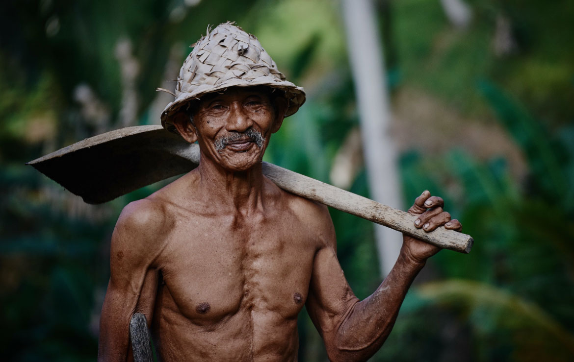 Man with Shovel over Shoulder